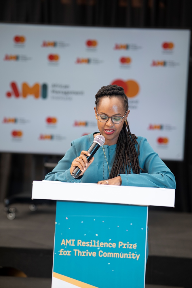 Elvine Binamungu , AMI's Programme Director addressing participants of the event.