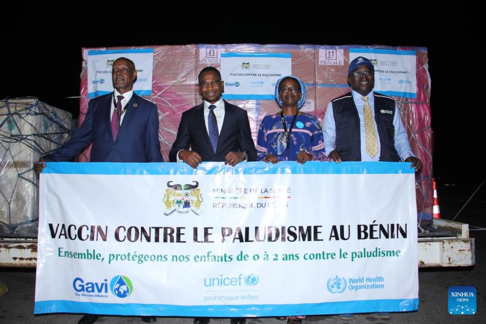 Beninese Minister of Health Benjamin Hounkpatin (2nd L) attends a handover ceremony for malaria vaccine at Cotonou International Airport in Cotonou, Benin, Jan. 15, 2024. The Beninese government received 215,900 doses of malaria vaccine at Cotonou International Airport on Monday and will begin administering them in the coming months.  Malaria remains endemic in Benin and is the leading cause of death among children under 5, accounting for 40 percent of outpatient consultations and 25 percent of all hospital admissions in the country. (Photo by Seraphin Zounyekpe/Xinhua)