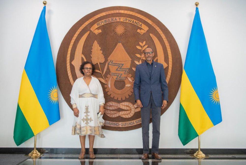 The outgoing ambassador of Ethiopia posing for a photo with President Paul Kagame.  