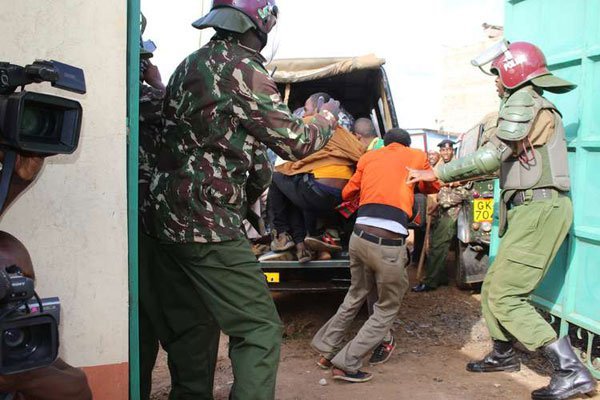 Police arrest some of the Ethiopian nationals found hiding in a house at Kamae, Kahawa West, in Nairobi on March 9, 2016.