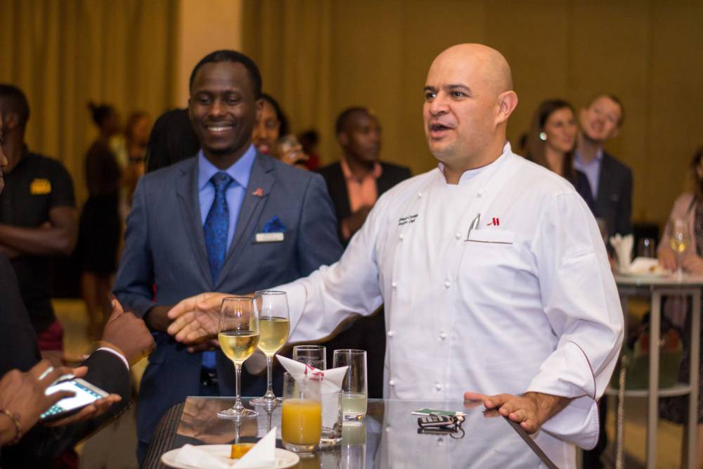 Executive Chef Eduardo Cornish shares a light moment with some of the guests