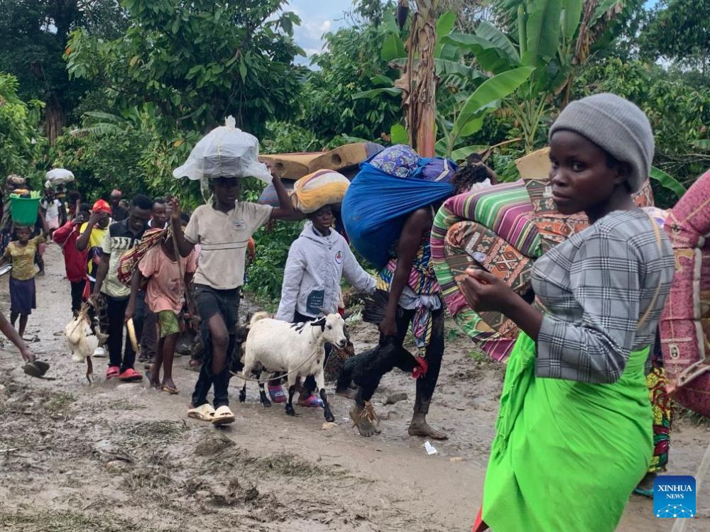 Congolese refugees are on their way to a holding center in the district of Bundibugyo, western Uganda, on Nov. 13, 2023. More than 1,000 refugees from the Democratic Republic of the Congo (DRC) have fled to Uganda following recent attacks by suspected Allied Democratic Forces (ADF) rebels, according to a local humanitarian organization. (Photo by Geoffrey Nyamwongera/Xinhua)