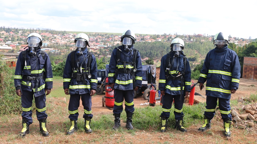 Police firefighters prepare for the demonstration on how to put out fire.