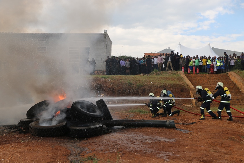 Police firefighters putting out fire during the demonstration.