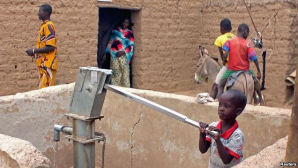 A child pumps water in the northern town of Kouroume, Mali, in May 2015. A UN envoy warns that the up to 41 million young people in the Sahel are at risk of radicalization.