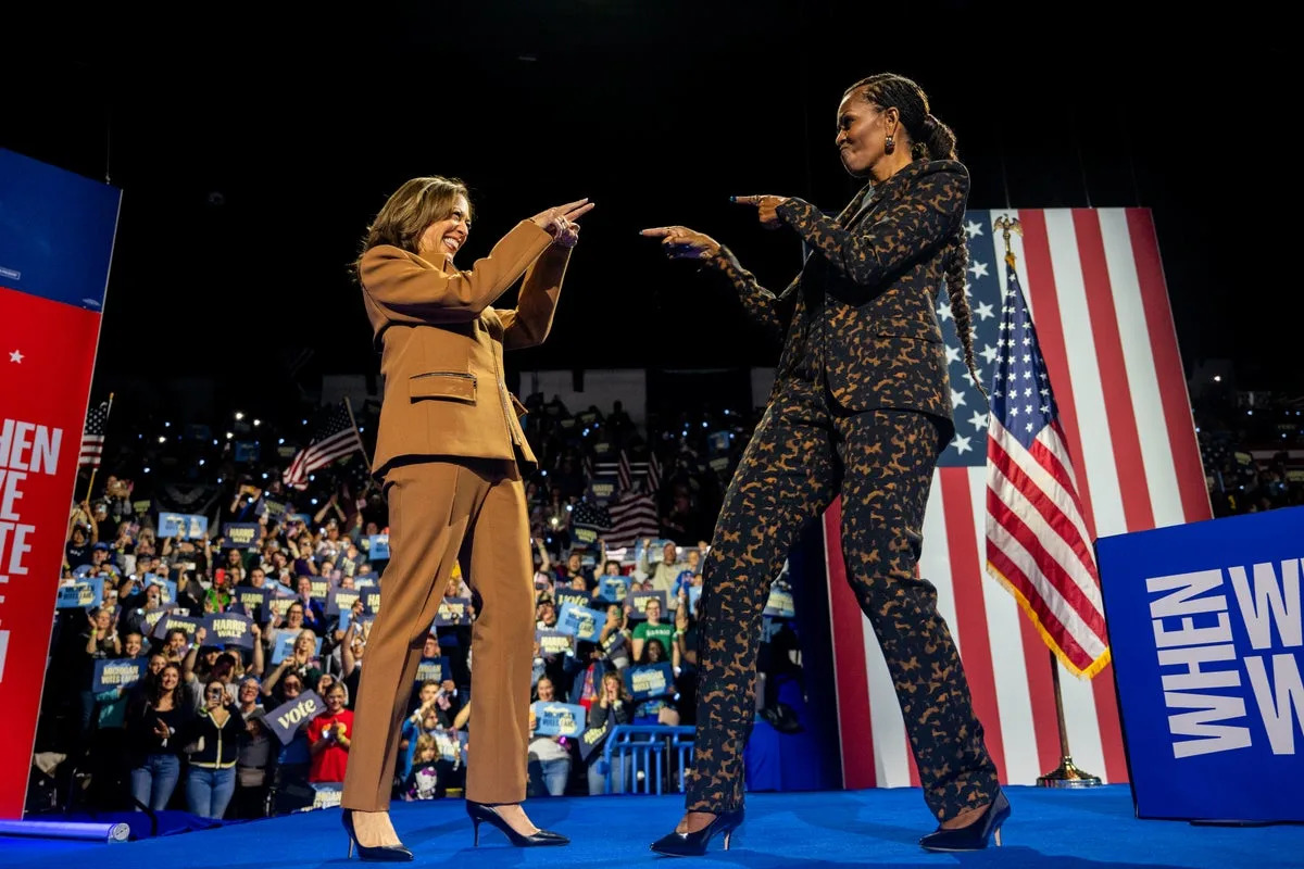 Former First Lady Michelle Obama and former Vice President Kamala Harris during a past campaign. Obama has said the United States still lacks the maturity to elect a woman to the nation’s highest office.