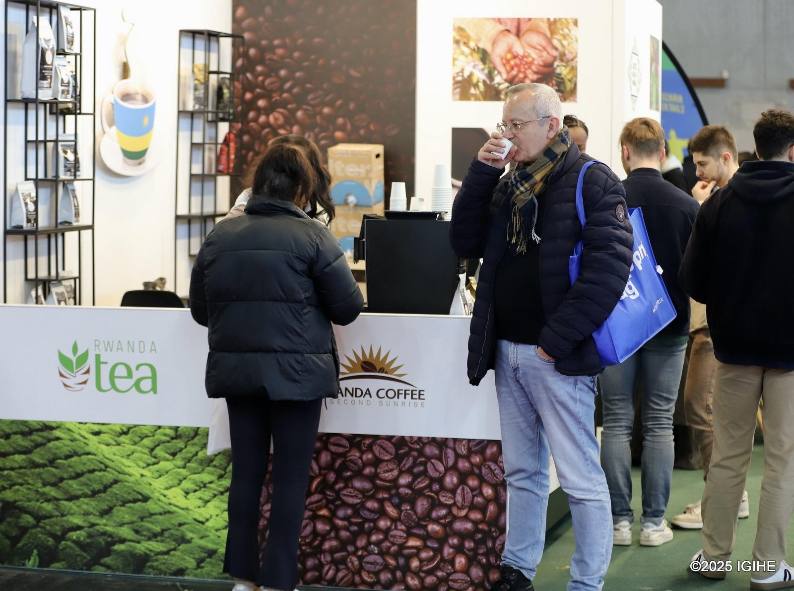 Visitors at the Rwanda stand enjoy Rwandan coffee and tea.
