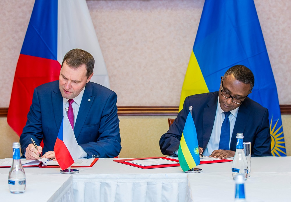 Minister Biruta and his counterpart signing the agreement on Tuesday. 