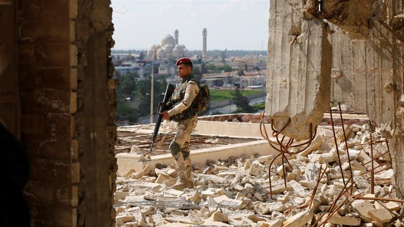 An Iraqi soldier patrols in eastern Mosul last month