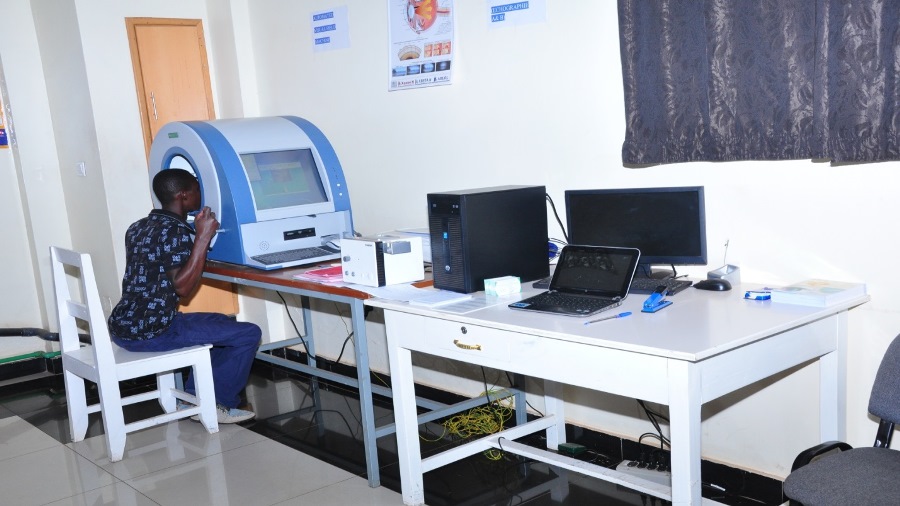 A patient undergoing visual field examination at Rapha Medical Clinic
