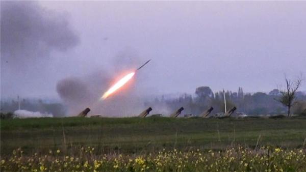 In this image made from a video released on April 3, a Grad missile is fired by Azerbaijani forces in the village of Gapanli, Azerbaijan