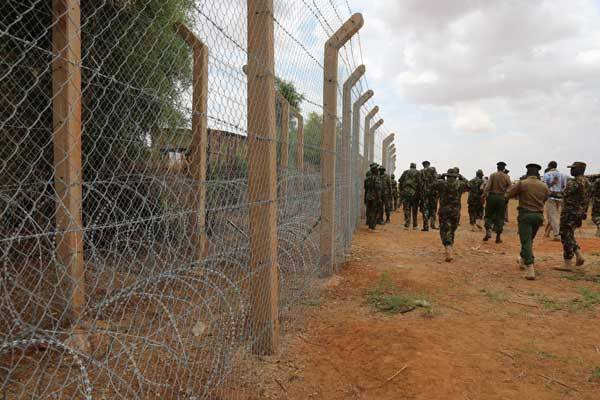 KDF personnel inspect the ongoing fencing of the Kenya-Somalia border in Mandera County. Governor Ali Roba lauded the progress made in two months.