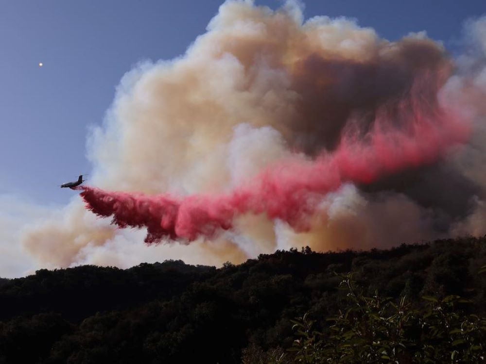 Wildfires tearing through Los Angeles County over the past 10 days have claimed at least 27 lives and destroyed more than 12,300 structures.