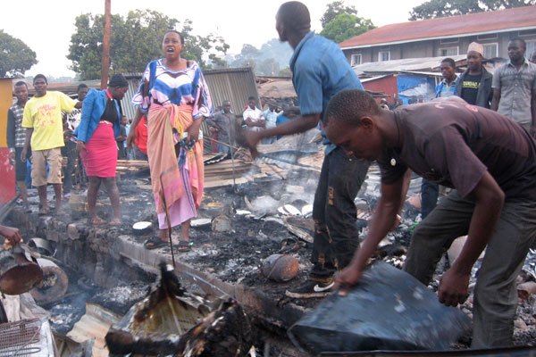 Traders of Kitooro market going through their razed property in hope of salvaging any usable property.