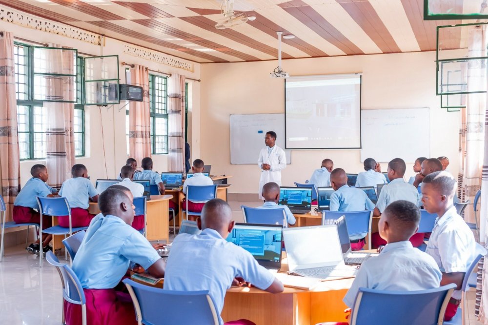 Students using laptops at Groupe Scolaire Gaseke in Gicumbi District, the first Rwandan school connected to Starlink's high speed internet in March 2023.