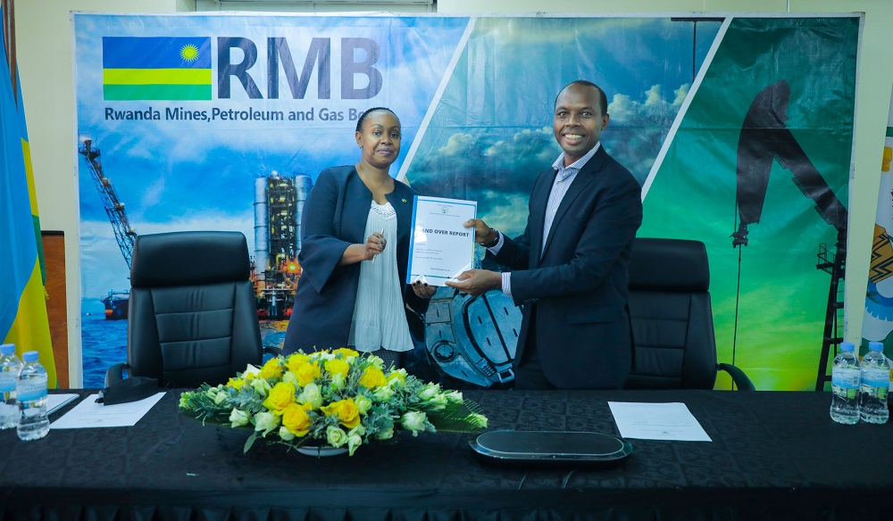 Amb. Karitanyi (left) receiving a handover report from the outgoing CEO on Tuesday 14th August 2021.