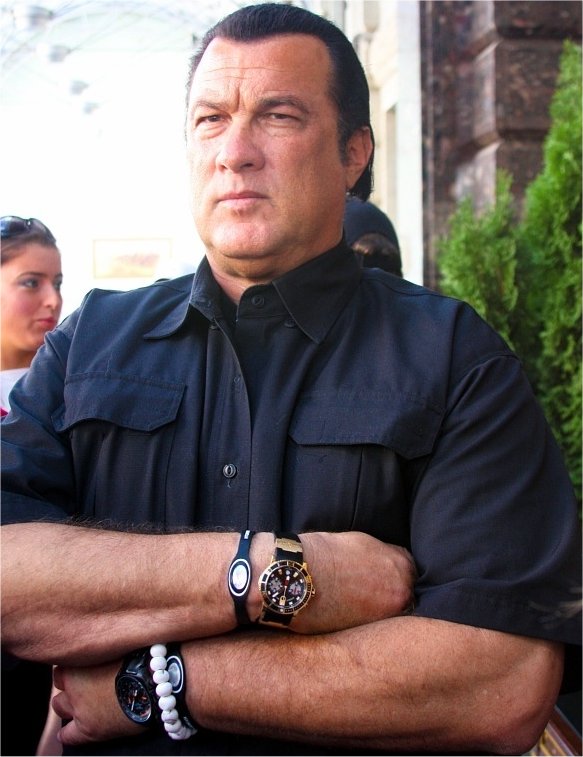 Movie Actor, Steven Seagal wearing a Power Balance bracelet