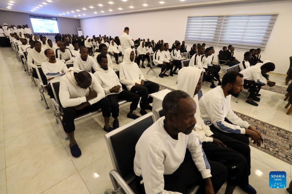 Illegal immigrants wait to depart at Libyan Illegal Migration Control Department in Tripoli, Libya, Nov. 28, 2023. The Libyan Illegal Migration Control Department on Tuesday repatriated 248 illegal migrants. Among them, 120 were deported by air back to Niger, while the remaining 128 were deported by land back to Chad, Badraddin Ben-Hamed, head of the Deportation Office of the department, told Xinhua. (Photo by Hamza Turkia/Xinhua)