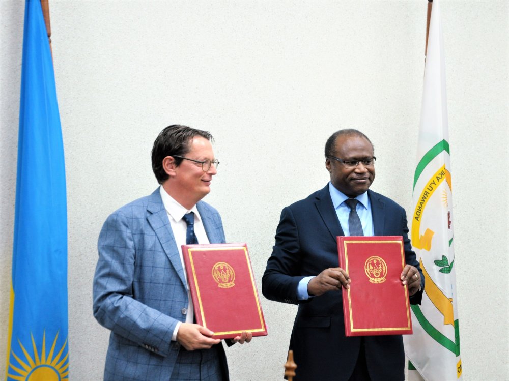 Minister Ndagijimana and Belgian Ambassador to Rwanda, Bert Versmessen after signing agreement. 