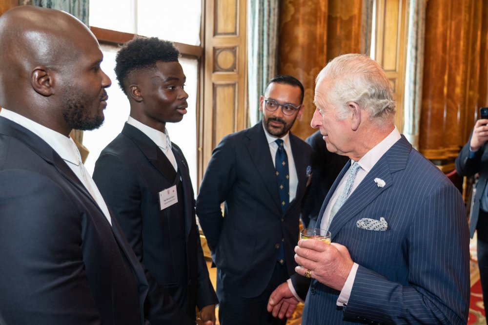 Prince Charles chatting with Arsenal player, Bukayo Saka. 