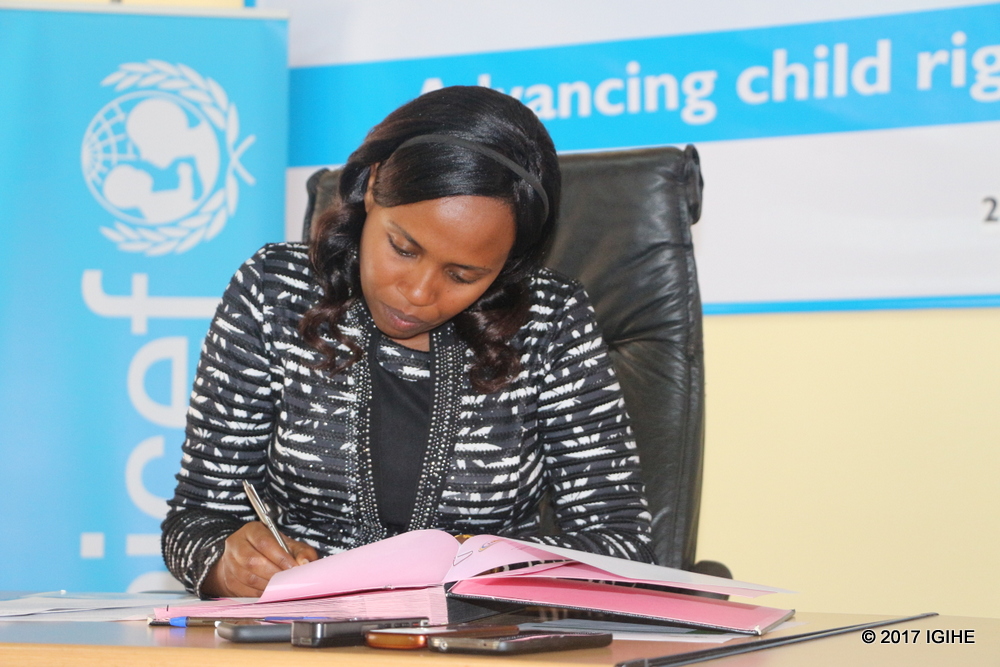 Sandrine Urujeni, Deputy CEO of NAEB signing the partnership agreement