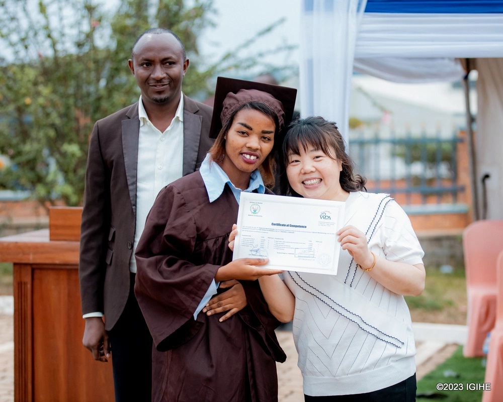 One of trainees receiving certificate of completion. 