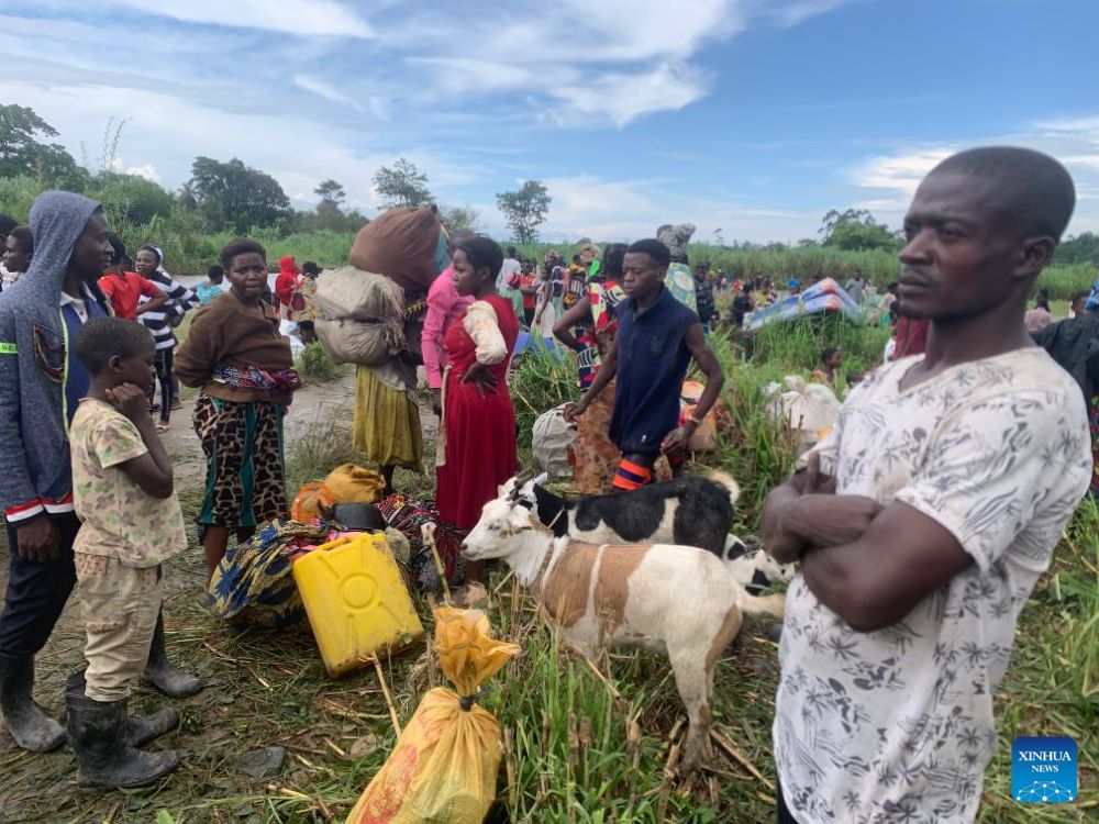 Congolese refugees are on their way to a holding center in the district of Bundibugyo, western Uganda, on Nov. 13, 2023. More than 1,000 refugees from the Democratic Republic of the Congo (DRC) have fled to Uganda following recent attacks by suspected Allied Democratic Forces (ADF) rebels, according to a local humanitarian organization. (Photo by Geoffrey Nyamwongera/Xinhua)