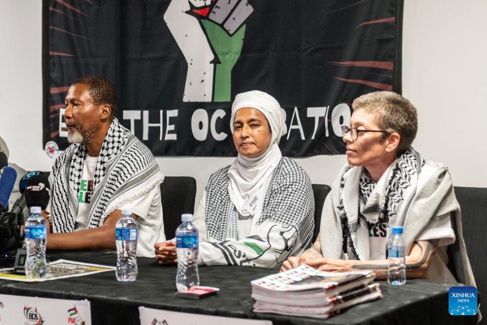 Mandla Mandela (L), grandson of late former President Nelson Mandela, and other South African activists attend a press conference following their arrival at OR Tambo International Airport in Johannesburg, South Africa, Oct. 8, 2025. Six South African activists from the Global Sumud Flotilla, detained by Israeli authorities while attempting to deliver humanitarian aid to Gaza, returned home on Wednesday in Johannesburg.