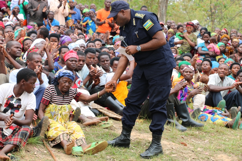 IGP Emmanuel K. Gasana holding one of the elderly women who will also be given solar energy in Gakenke.