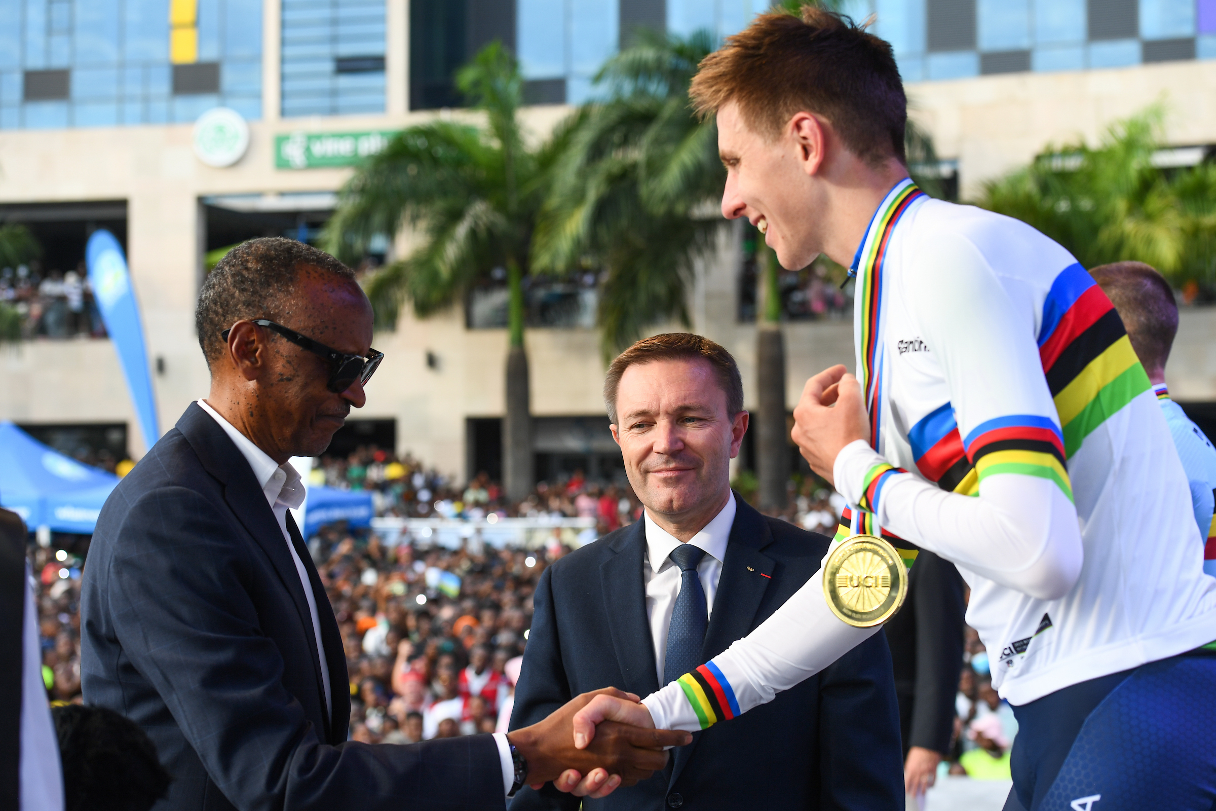 President Paul Kagame awarded a gold medal and rainbow jersey to Tadej Pogačar, who lit up Kigali's climbs with a trademark long-range attack to secure a second consecutive men’s road race world title on Sunday.