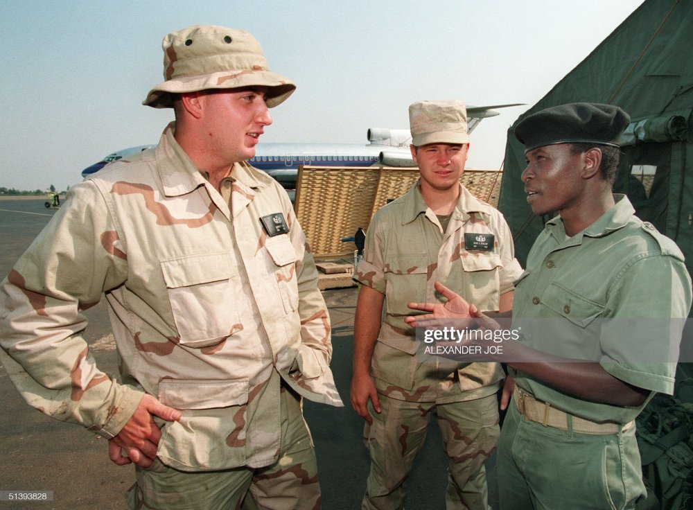 RPA soldiers interacting with US soldiers in Kanombe after the Liberation Struggle. 