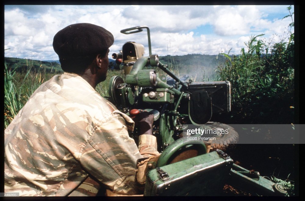 This photo shows RPA soldier using a Machine Gun mounted in Byumba on April 17, 1994.