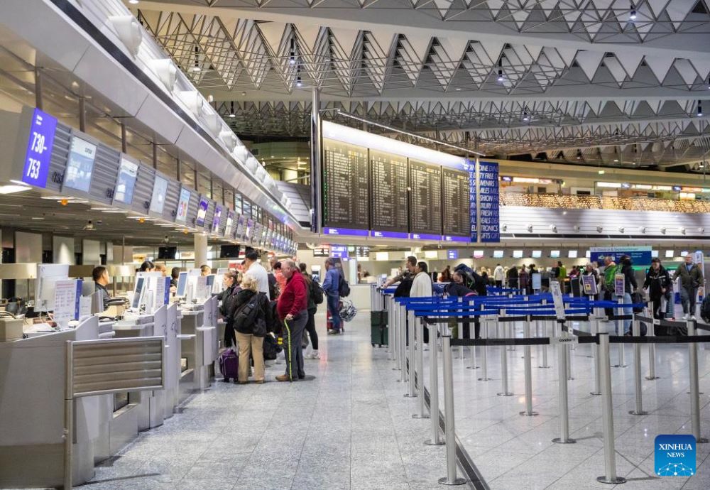 Passengers are seen at check-in counters at Frankfurt Airport in Frankfurt, Germany, on Jan. 3, 2025. (Xinhua/Zhang Fan)