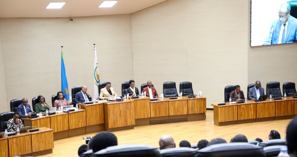 Dr. Ndagijimana presenting the draft budget to members of the Parliament.