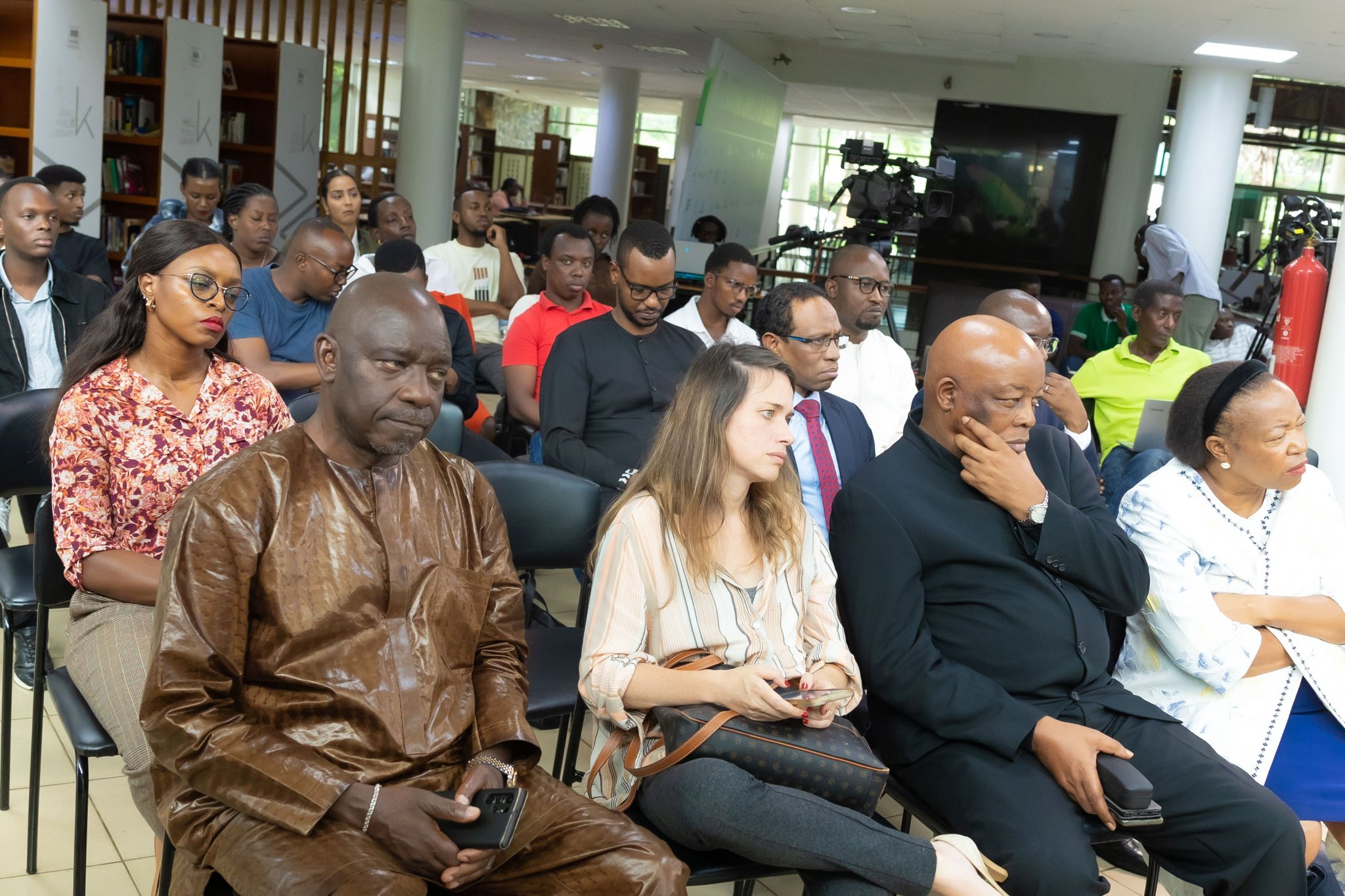 The audience keenly follows Barbara Umuhoza's discussion with Carl Wilkins on his book ‘I’m Not Leaving,’ written in the aftermath of the 1994 Genocide against the Tutsi.