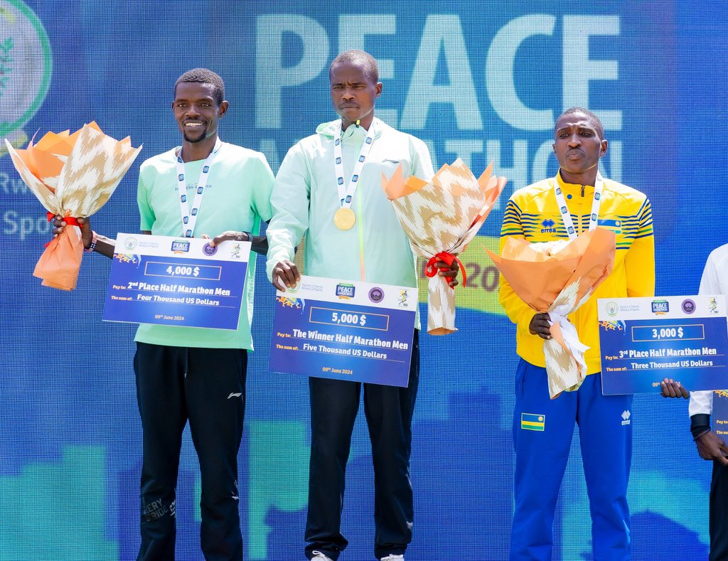 Francis Kipkorir, Leonard Kipkoech and Emmanuel Mutabazi awarded after their victory in the men's half marathon category.