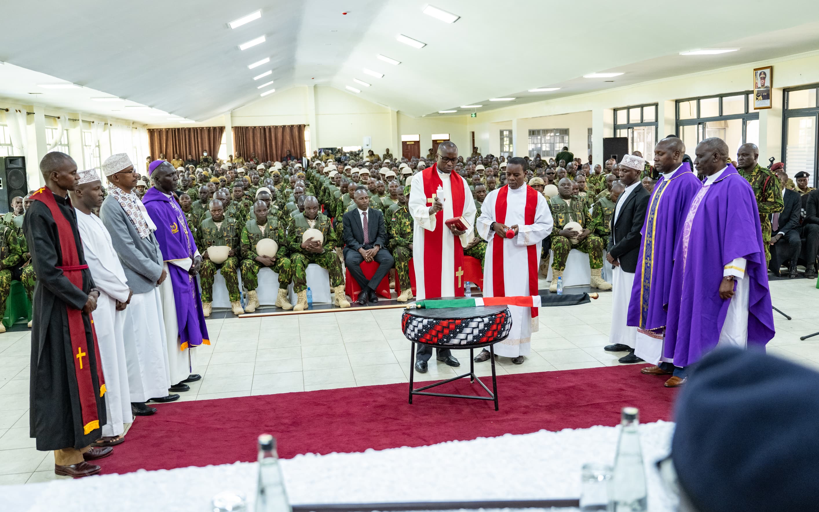 The clergy prays for the Kenyan police officers ahead of deployment to Haiti.