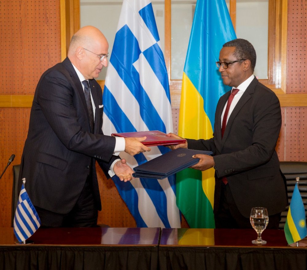 Minister Biruta and his counterpart of Greece exchanging documents after signing MoUs.  