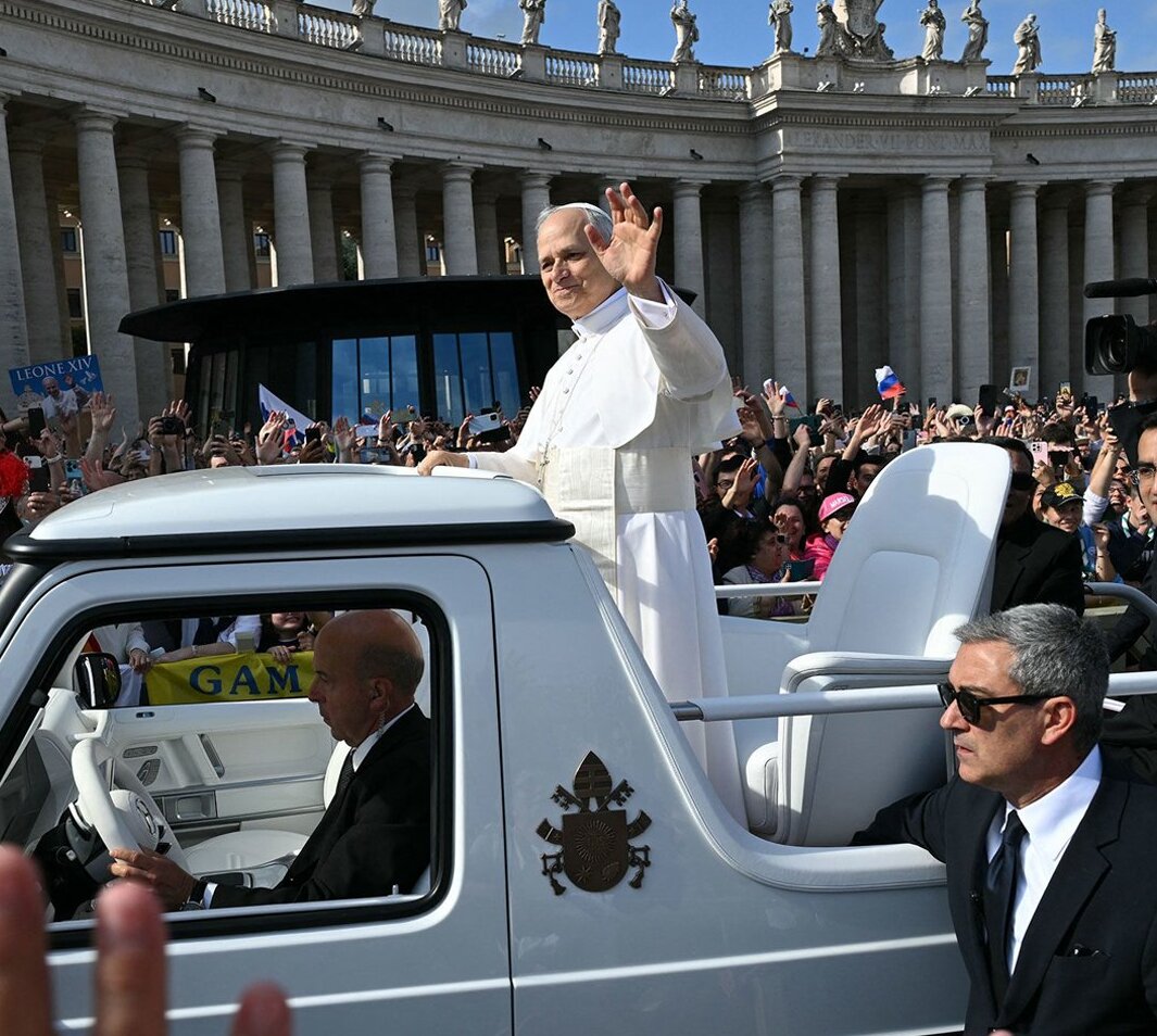 Pope Leo greets crowds from popemobile during his inauguration Mass on Sunday, May 18, 2025.