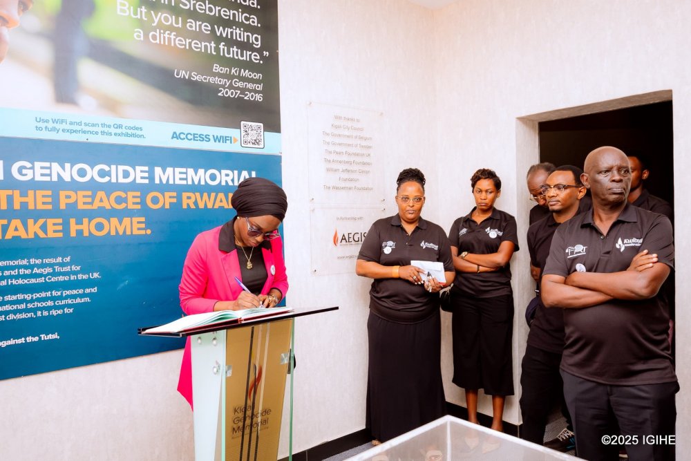 Salama Umutoni , second vice-president of Rwanda Olympic Commmittee signing the guest book.