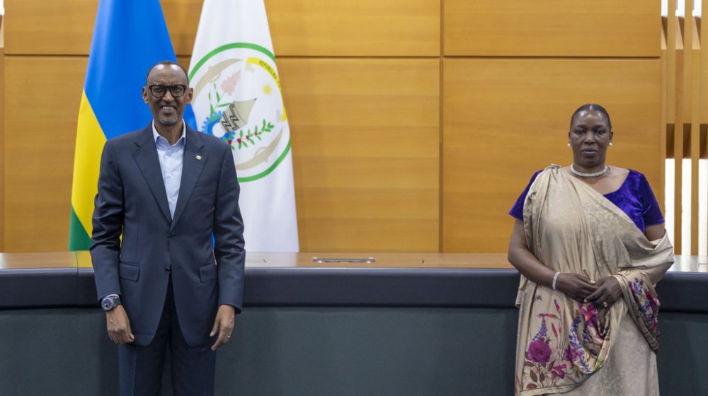 President Paul Kagame and the new ombudsman, Madeleine Nirere posing for a photo after the swearing-in ceremony.  