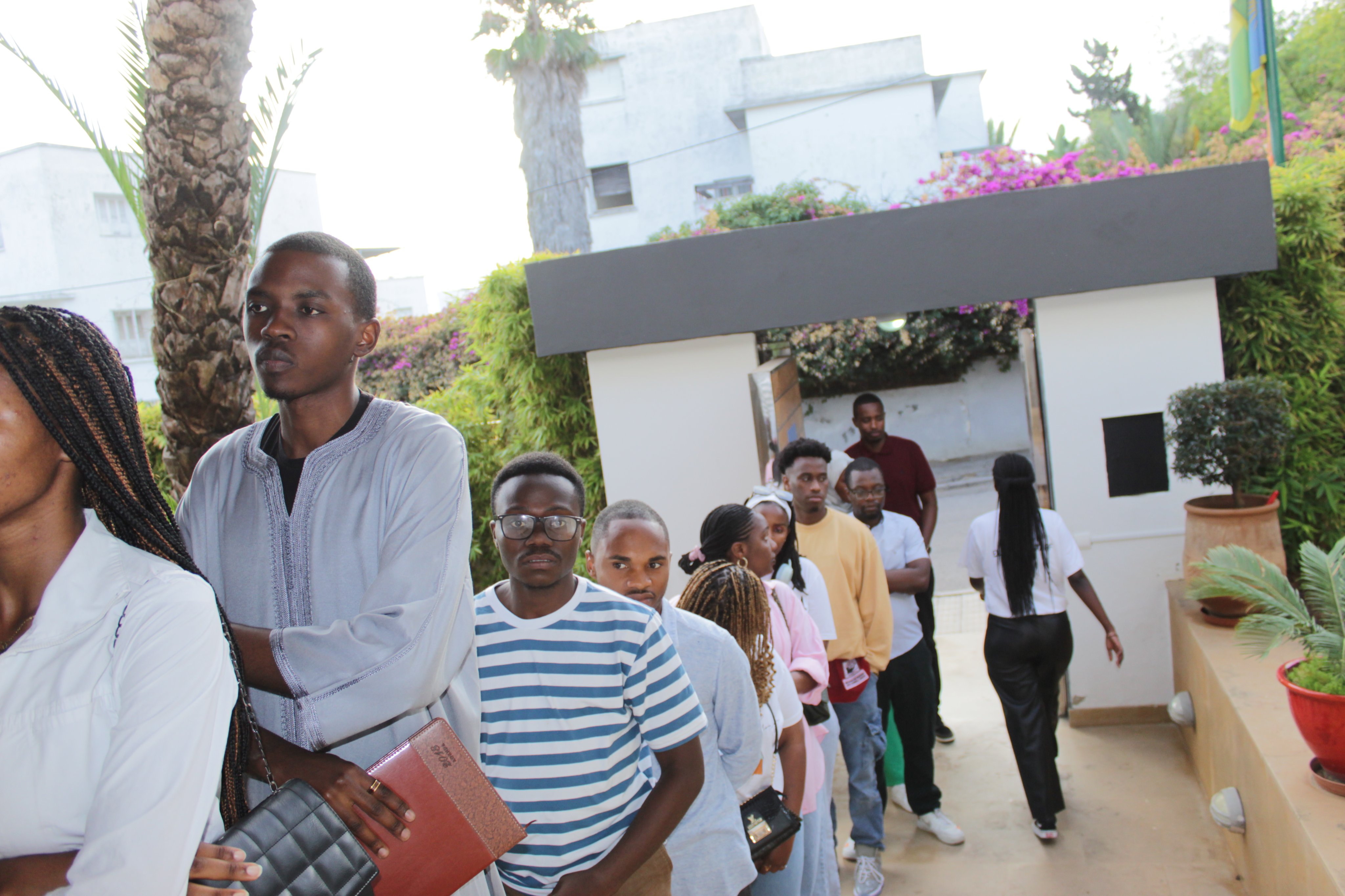Rwandans queue at the Rwandan Embassy in Rabat, Morocco, to vote in this year's general election.