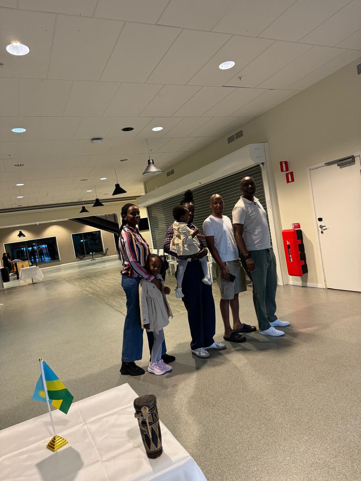 A family waits patiently on the queue to vote at Gothenburg in Sweden.
