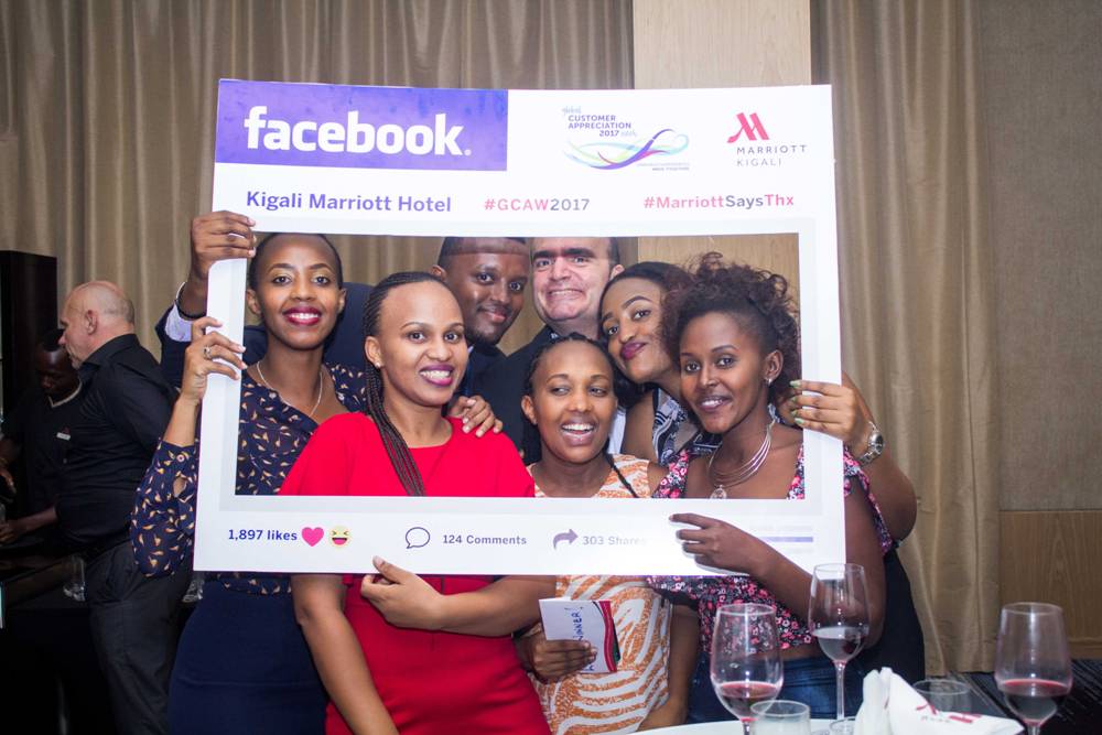 Guests take a social media photo with Kigali Marriott staff