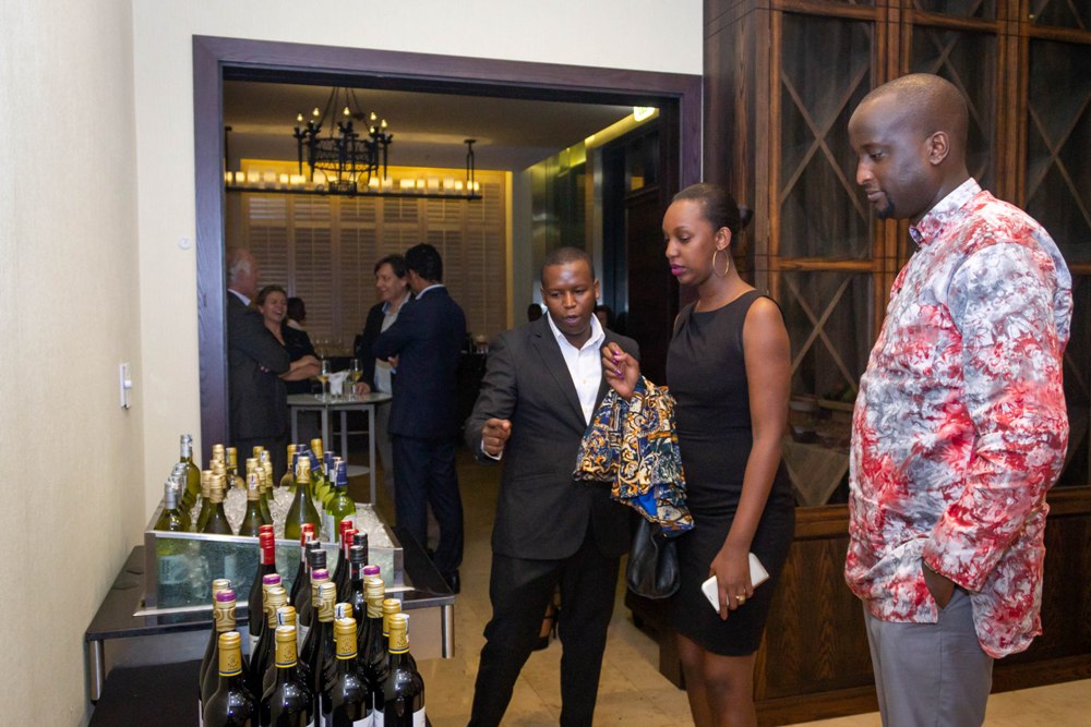 Guests examine new wine types during the Kigali Marriott's Wine Tasting
