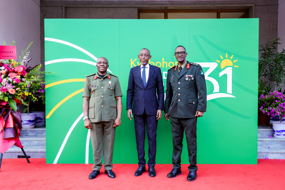 Guests pose with the Ambassador James Kimonyo.