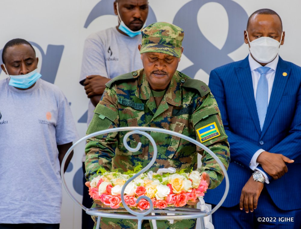 The Commander of Rwanda Defence Force (RDF) troops in Nyarugenge and Gasabo, Maj Paul Ndushabandi laying wreaths at the memorial's mass grave.  