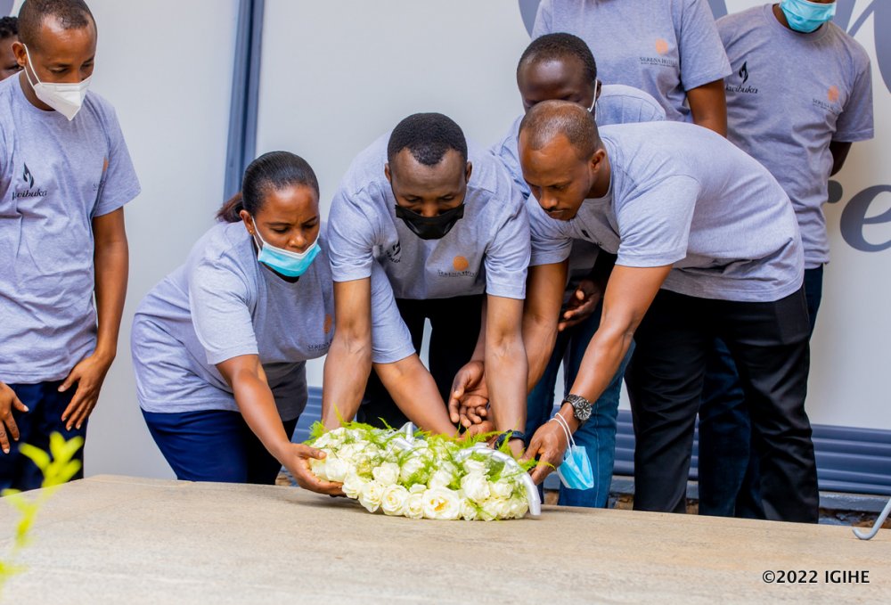 The hotel's employees laying wreaths at Kigali Genocide Memorial. 