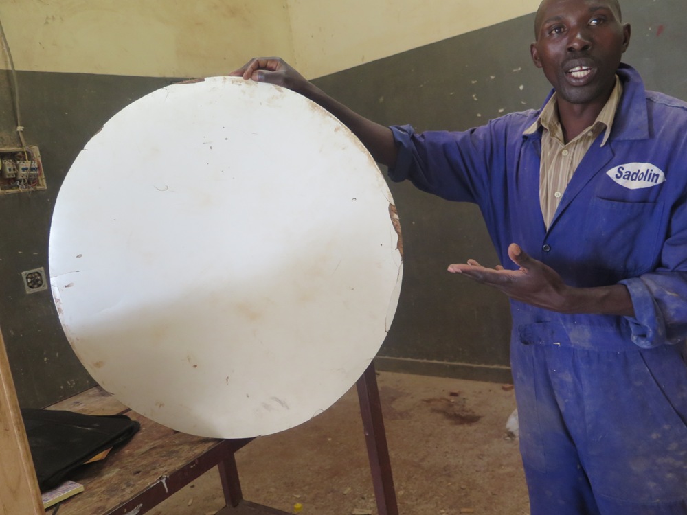 Habiyaremye explains how he makes fibreboards from banana stems and other grasses