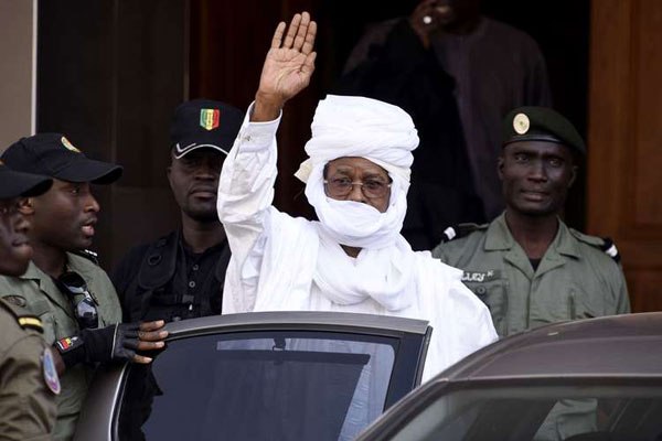 A file picture taken on June 3, 2015 shows former Chadian dictator Hissene Habre gesturing as he leaves a Dakar courthouse after an identity hearing on June 3, 2015. A special court will hand down the verdict in the landmark war crimes trial of former Chadian dictator on May 30, 2016.